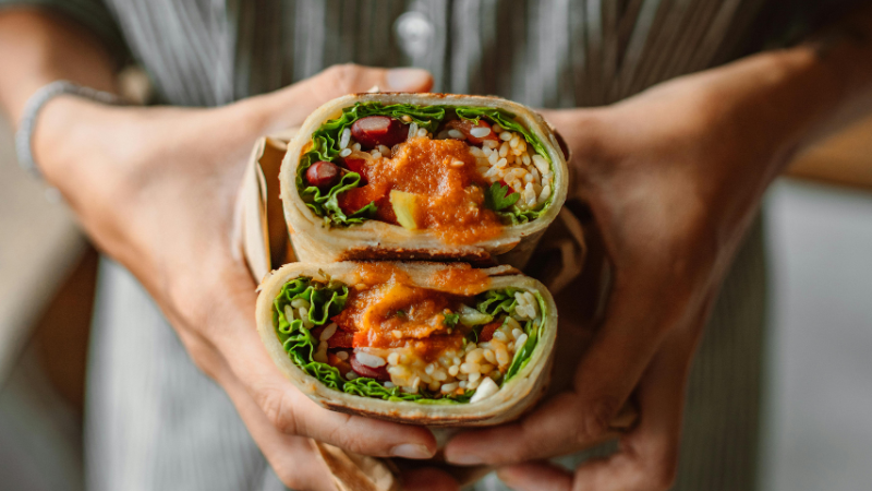person holding wraps